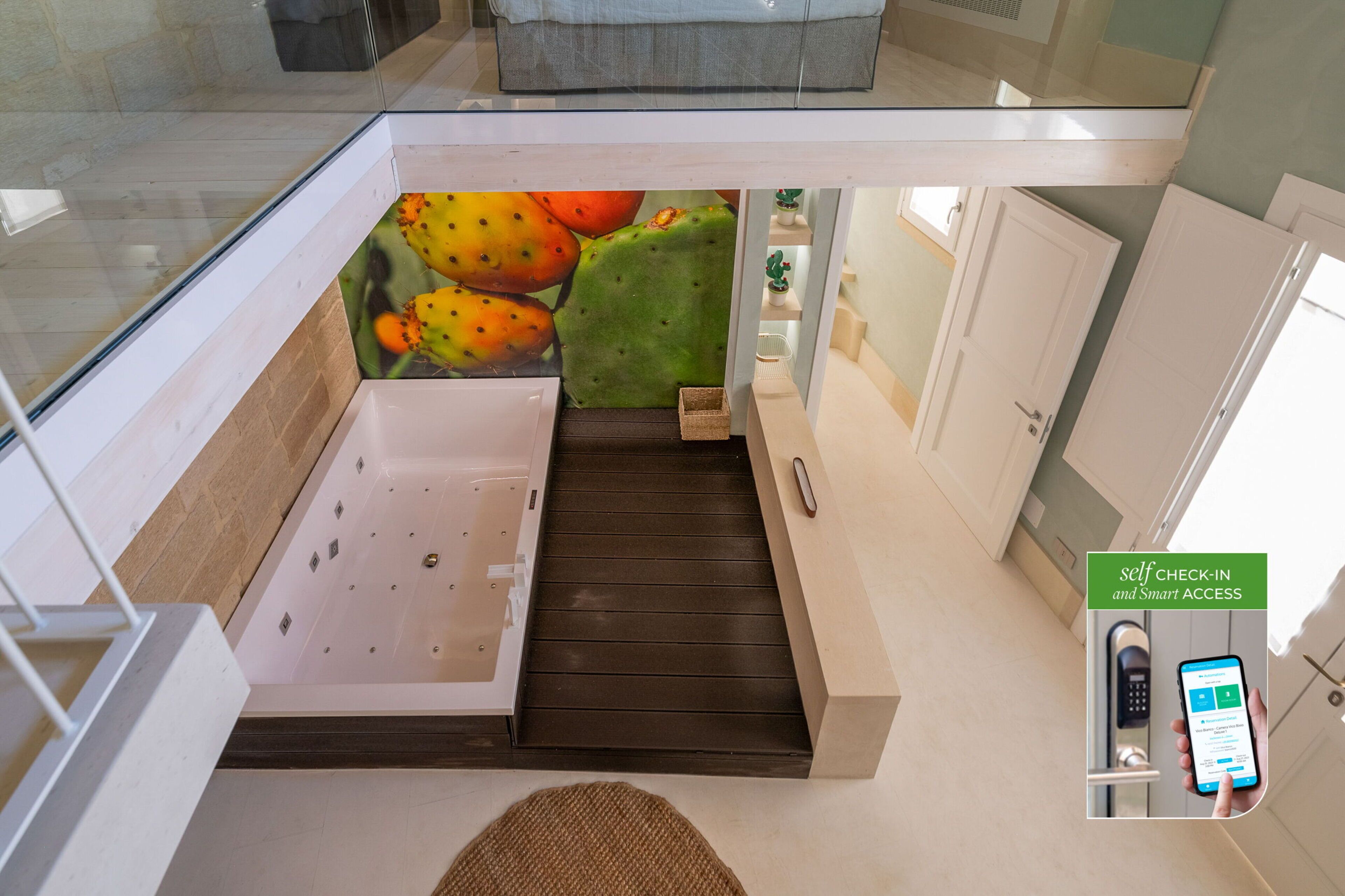 A modern hotel room with a glass-enclosed balcony, a bathtub, and a self-check-in system.