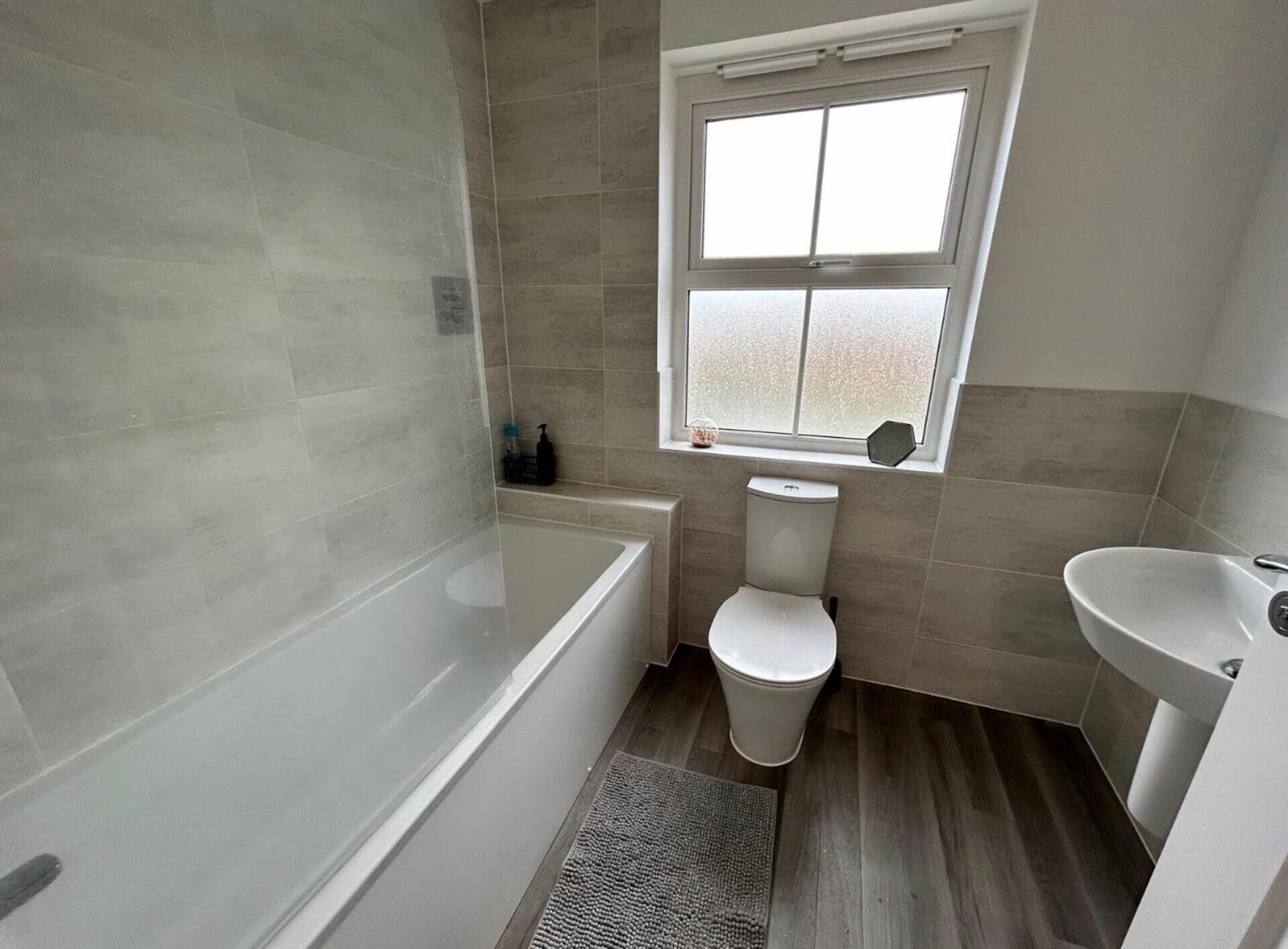 Combined shower/bathtub, deep-soaking bathtub, towels
