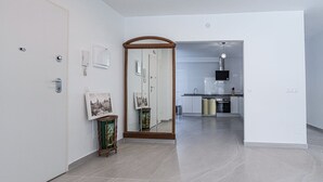 A modern kitchen with stainless steel appliances, a dishwasher, and a built-in oven.