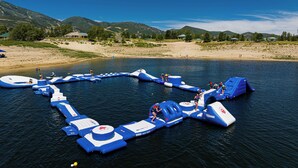 A water park with inflatable structures and a beach area. - Mayflower Vista - Deer Valley East Basecamp for All Seassons w/ Views, Private Hot Tub (Heber City)