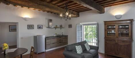 Apartment, Pool View | Living area | Flat-screen TV