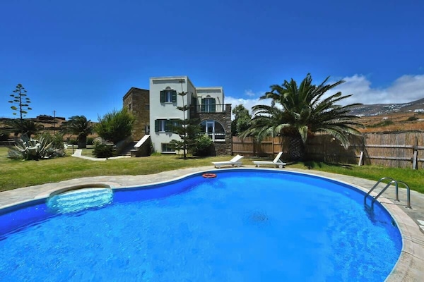 Private Swimming Pool Surrounded by Lush Greenery