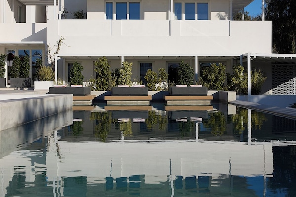 Indoor pool, seasonal outdoor pool, pool umbrellas, sun loungers