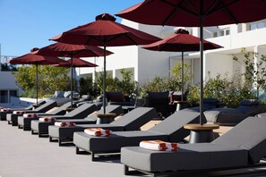 Indoor pool, seasonal outdoor pool, pool umbrellas, pool loungers