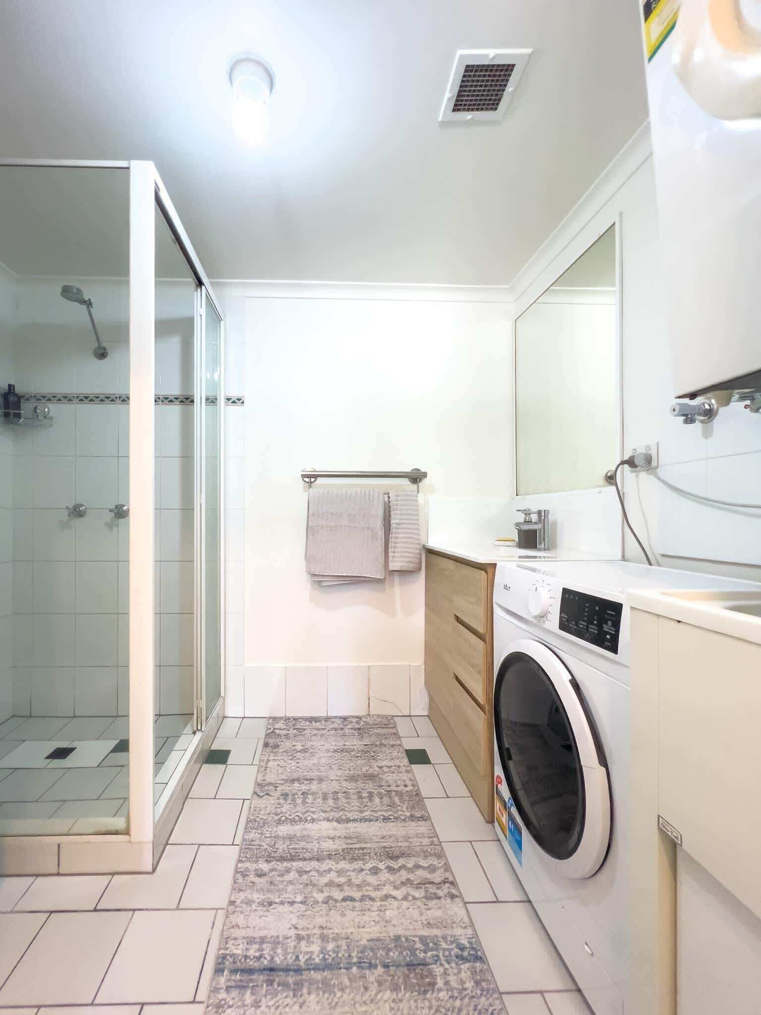 Shower, hair dryer, towels, shampoo