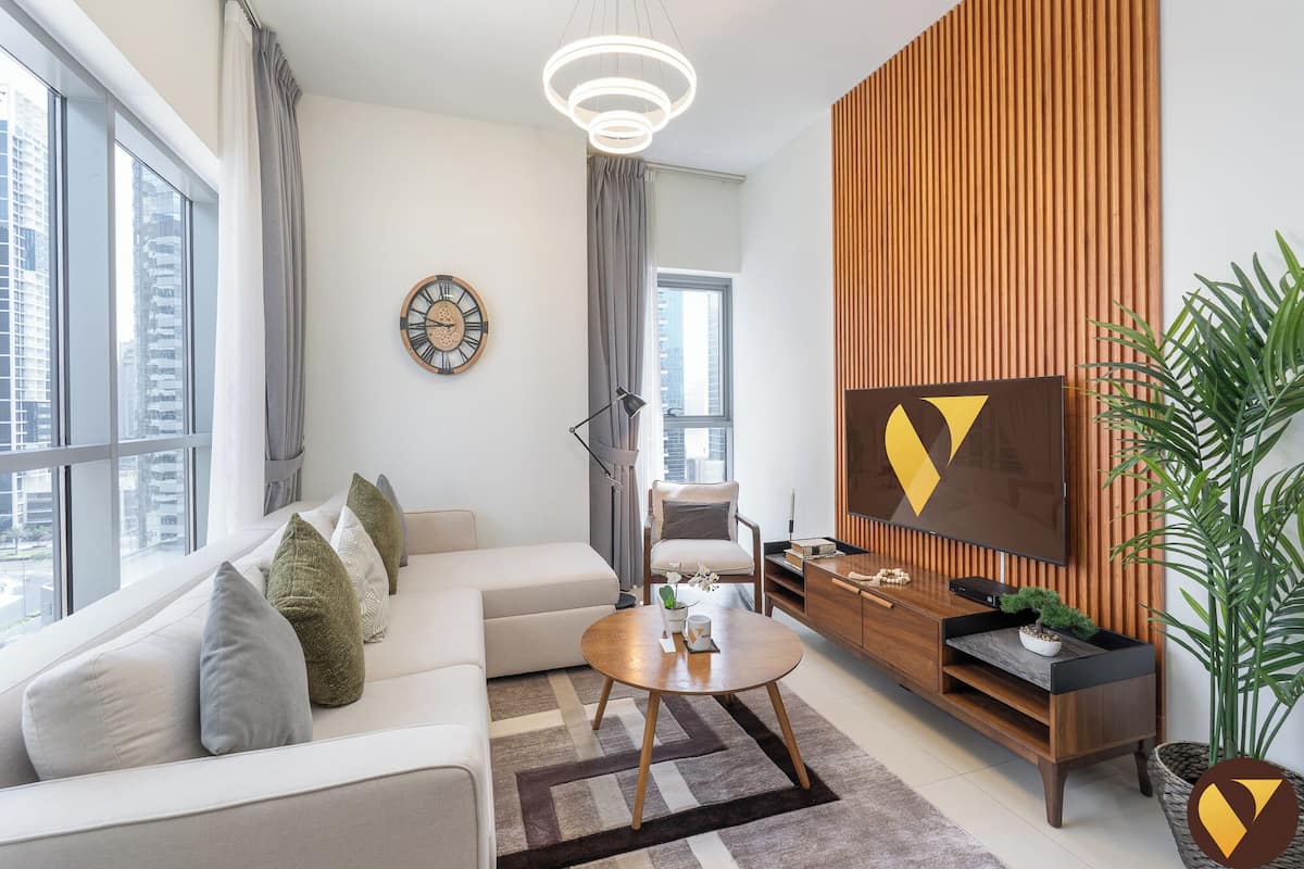 Luxury Apartment, Balcony, Canal View | Living area | 65-inch Smart TV with cable channels