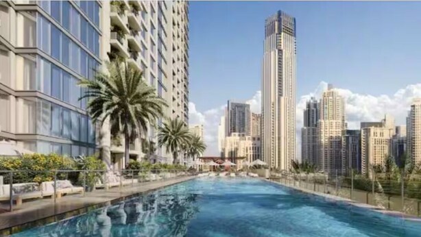 A swimming pool with a cityscape in the background. - Vogue | Downtown near Dubai Mall | Burj Khalifa (Dubai)