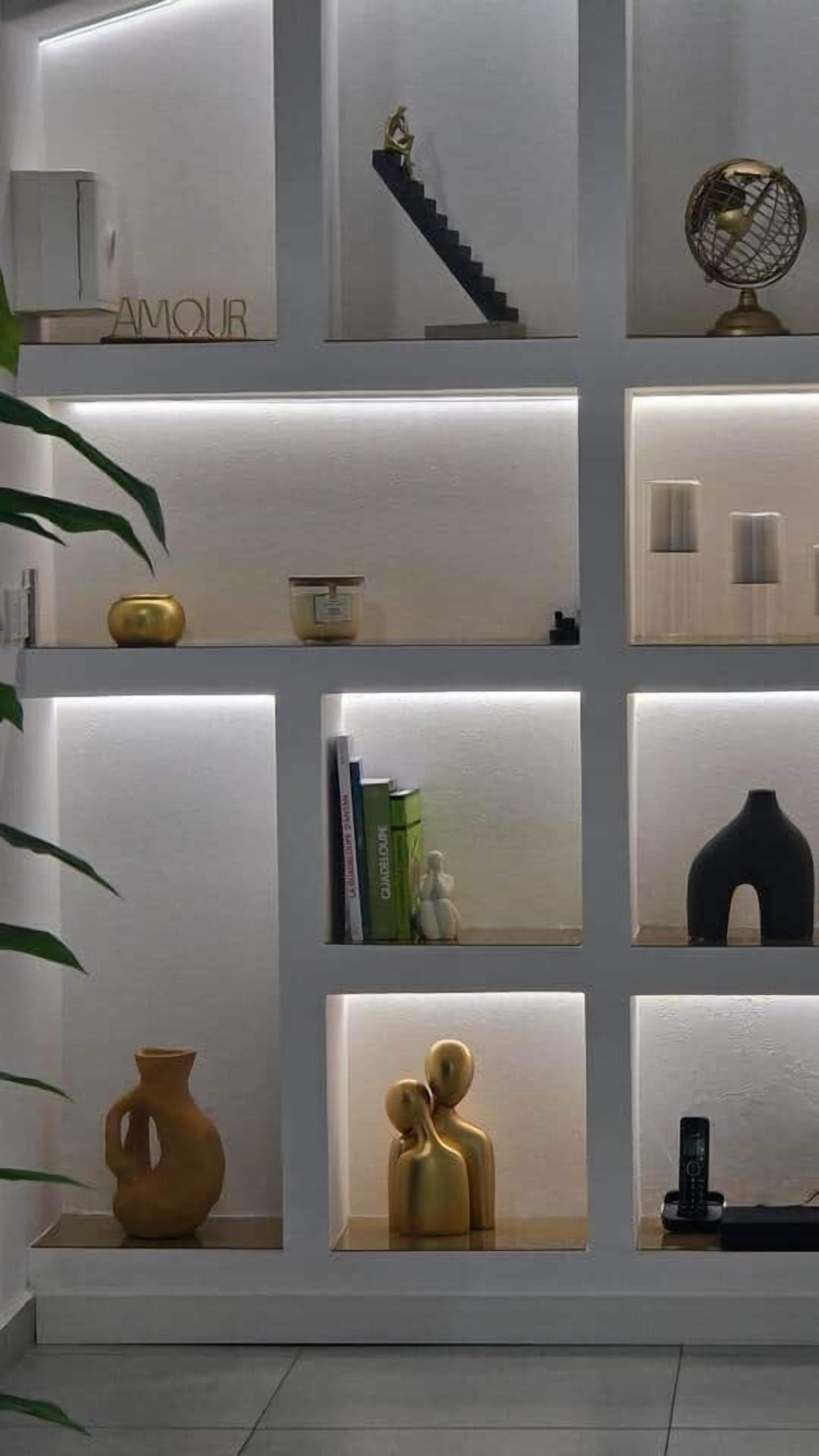 A modern interior with a staircase, a globe, and various decorative items.