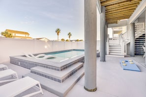 A swimming pool with a hot tub, white lounge chairs, and a game table. - For Whom The Beach Tolls: New Coastal Retreat w/ Pool & Stunning Views (Murrells Inlet)