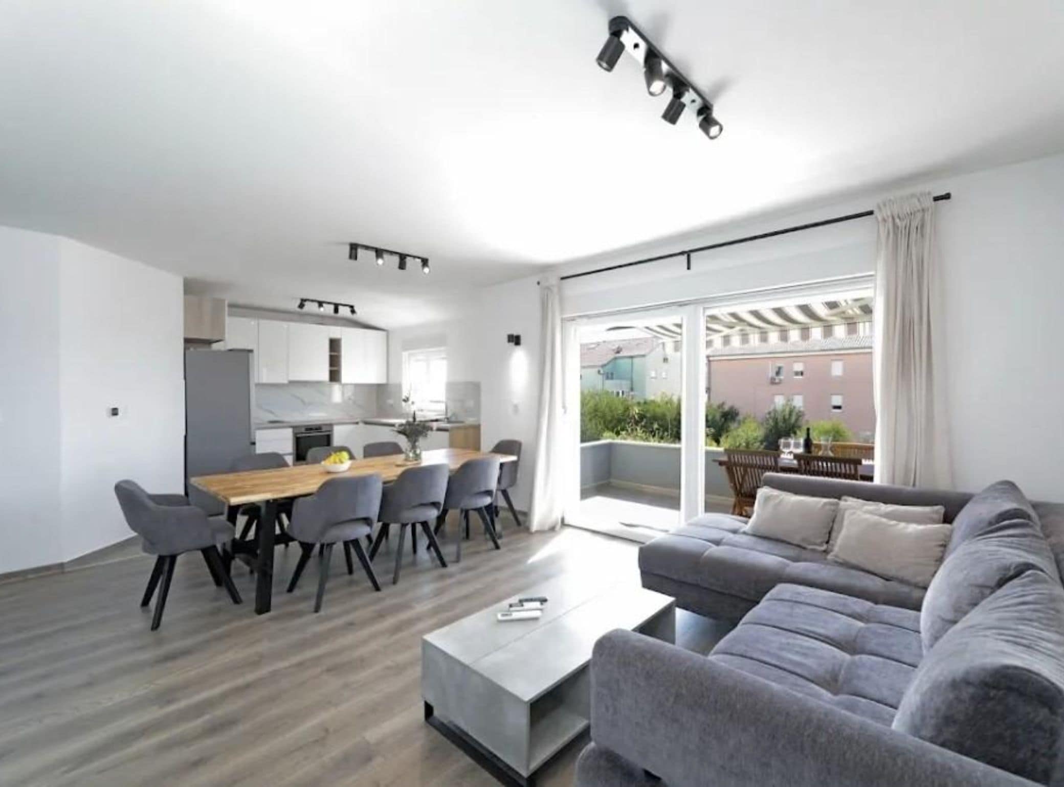 Apartment (Three Bedroom Apartment with Balcony) | Living room | 32-inch flat-screen TV with cable channels