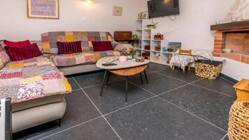 House (Holiday home Kuzmino) | Living room | 32-inch Smart TV with satellite channels