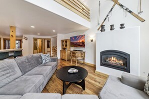TV, fireplace, table football - Serene Creekside Chalet: Hot Tub, Games, BBQ (South Lake Tahoe)