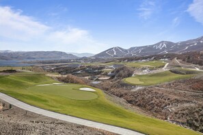 A golf course with a clear view of the surrounding mountains and a lake. - Spacious Ski Getaway Hot Tub 5 Bedroom 5 Home (Heber City)