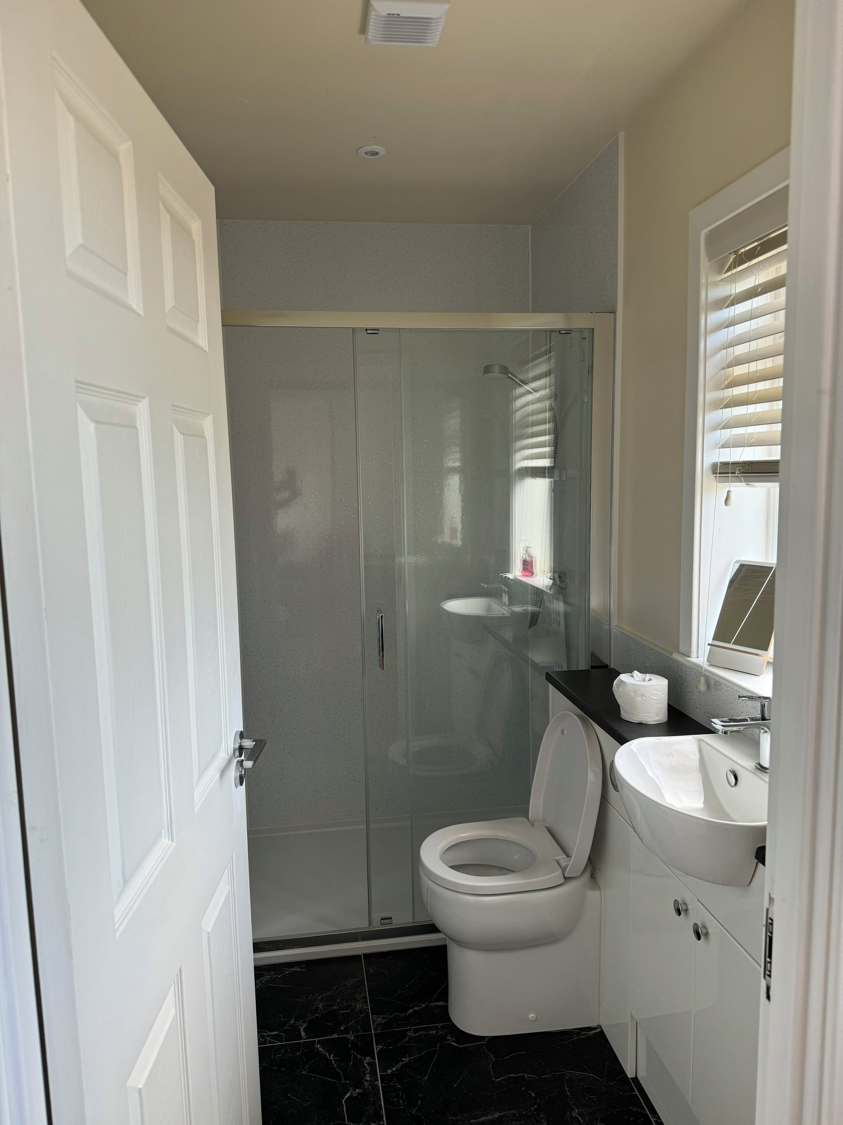 Shower, hair dryer, towels, soap
