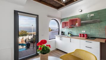 Fridge, microwave, stovetop, coffee/tea maker