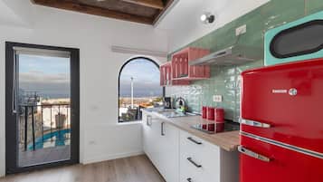 Fridge, microwave, stovetop, coffee/tea maker