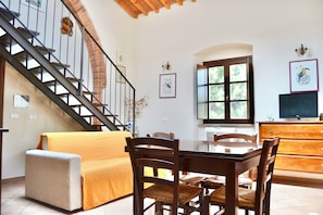 Family Duplex | Living area | 24-inch flat-screen TV with cable channels, table tennis