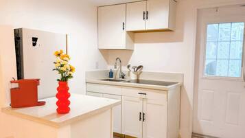 Fridge, microwave, stovetop, coffee/tea maker