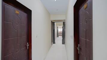 A corridor with two doors, each marked with a number.