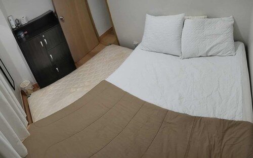 Amazing 2-bedroom budget apartment with AC and prepaid wi-fi in Trees Residences