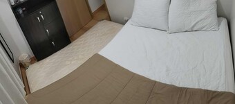 Amazing 2-bedroom budget apartment with AC and prepaid wi-fi in Trees Residences