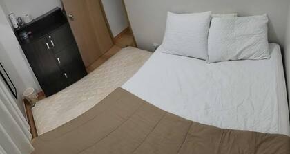 Amazing 2-bedroom budget apartment with AC and prepaid wi-fi in Trees Residences