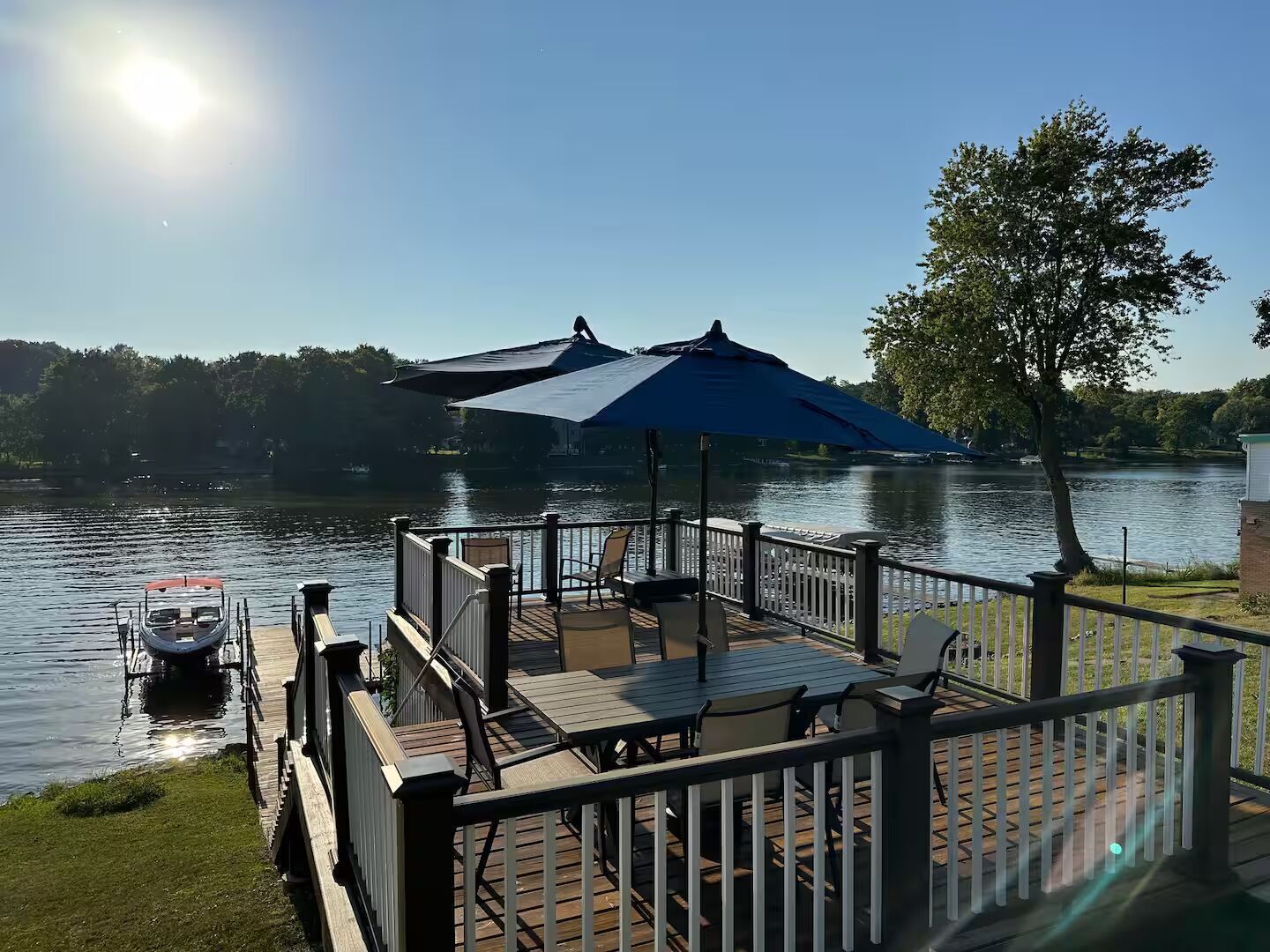 Beautiful back deck, large navy canopy, chairs, table seats six with umbrella