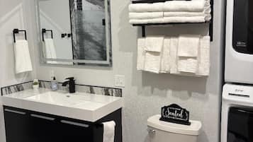 Shower, towels, soap, toilet paper