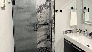 Shower, towels, soap, toilet paper