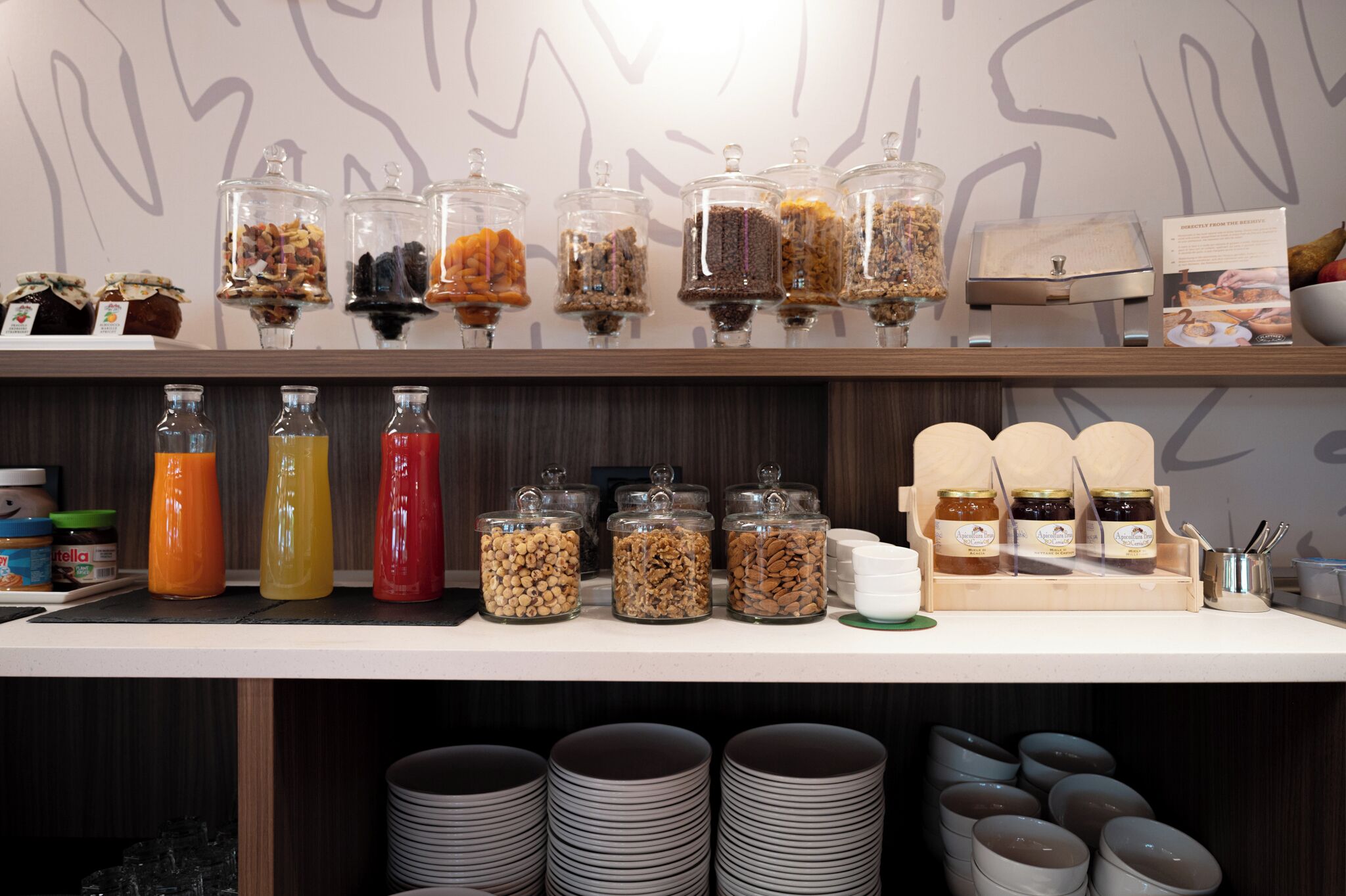 A breakfast buffet with various food items and condiments.