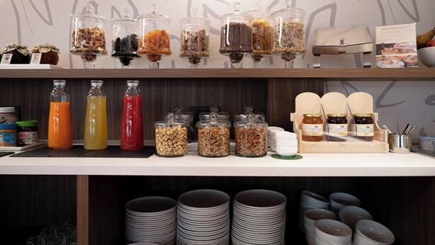 A breakfast buffet with various food items and condiments. - MOKO LIFESTYLE HOTEL-Nuova apertura 2026 (Milano Marittima)