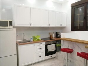 Family Apartment | Private kitchen | Fridge, microwave, oven, stovetop