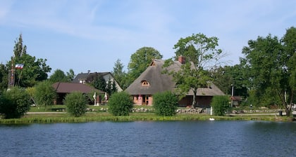 Vacation apartment directly at the fishing pond with parking lot and terrace