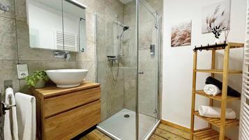 Shower, hair dryer, towels, soap