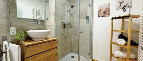 Shower, hair dryer, towels, soap