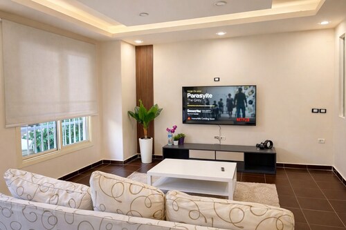 Private Garden Lovely 2-bedroom apartment with AC in El Sheikh Zayed City