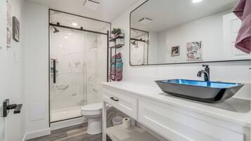 Shower, towels, soap, toilet paper