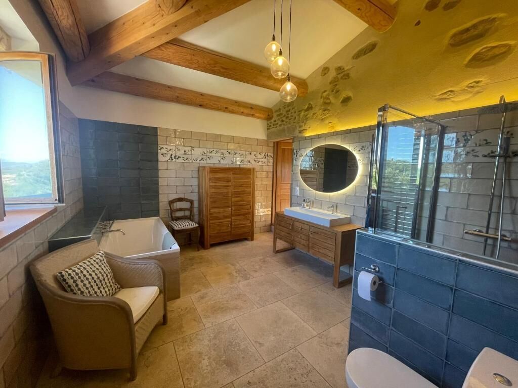A bathroom with a bathtub, a sink, and a toilet.