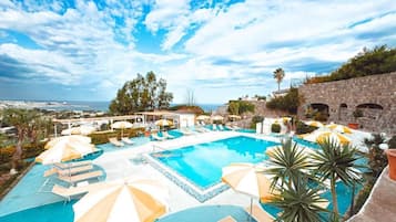 Indoor pool, outdoor pool, pool umbrellas, pool loungers