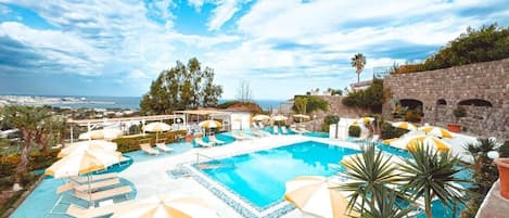 Indoor pool, outdoor pool, pool umbrellas, sun loungers