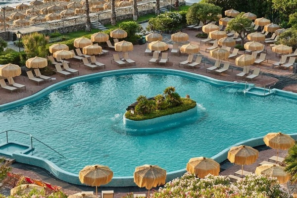 Indoor pool, outdoor pool, pool umbrellas, sun loungers