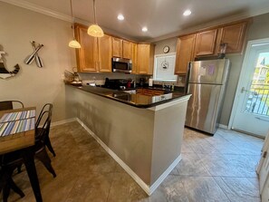 Fridge, microwave, oven, stovetop - Beach View Condo Long Beach, MS (Long Beach)