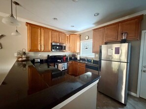 Fridge, microwave, oven, stovetop - Beach View Condo Long Beach, MS (Long Beach)