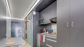 Fridge, microwave, stovetop, coffee/tea maker