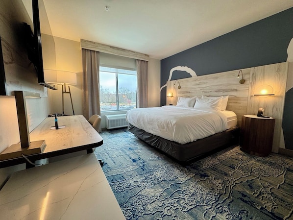 Desk, laptop workspace, blackout drapes, iron/ironing board