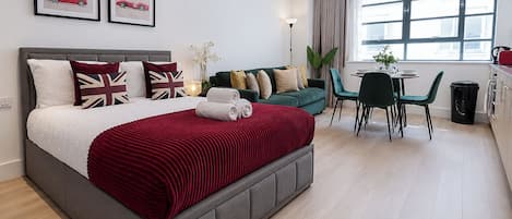 1 bedroom, desk, iron/ironing board, travel crib