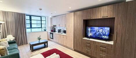 1 bedroom, desk, iron/ironing board, travel crib