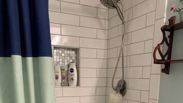 Shower, hair dryer, towels, toilet paper