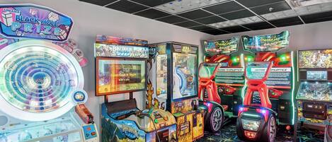 A variety of arcade games, including 'Big Buck Wild' and 'The Hunting Game Just for You'.
