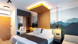 A modern hotel room with a large bed, a wooden accent wall, and a mountain mural. - 5 stars Luxury Villa in Lopar on island Rab (LOPAR (RAB))
